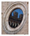 Spedisci la cartolina "Riflessi sul rosone del Duomo di San Gimignano"